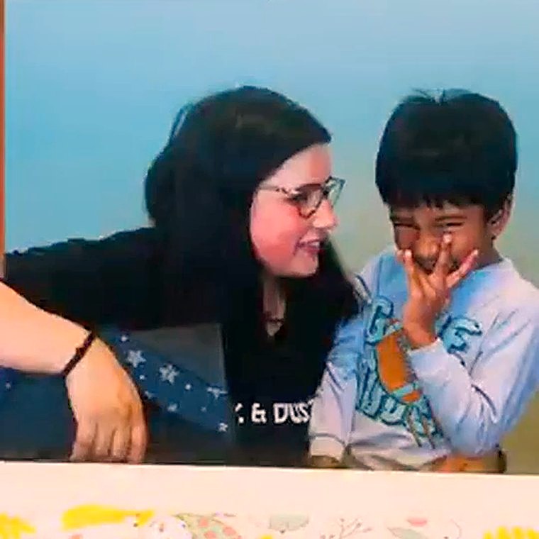 Ms. Praddy with children at Chalk & Duster