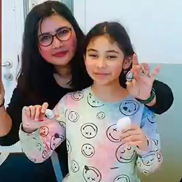 Ms. Praddy with children at Chalk & Duster