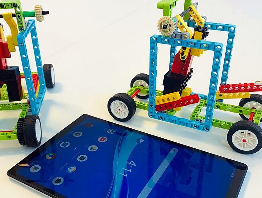 Robot cars and a tablet ready to code